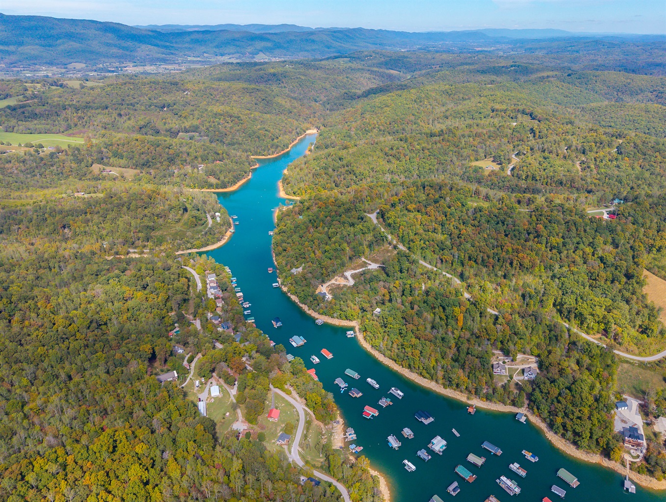 Aerial drone view of Norris Lake waters surrounded by forested East Tennessee ridgelines